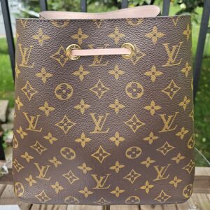 Front view of the Louis Vuitton Monogram NeoNoe MM showing the bright Monogram canvas and pink trim