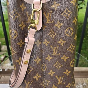 Rose Poudre leather strap and gold-tone hardware on the side of the Louis Vuitton NeoNoe MM