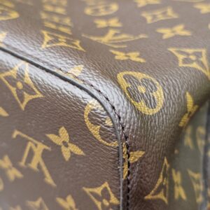 Side seam and Monogram canvas of the Louis Vuitton NeoNoe MM bucket bag