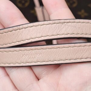 Rose Poudre leather shoulder strap of the Louis Vuitton NeoNoe MM showing wear and glazing loss