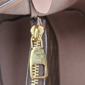 Gold-tone LV engraved zip pull inside the Louis Vuitton Monogram NeoNoe MM