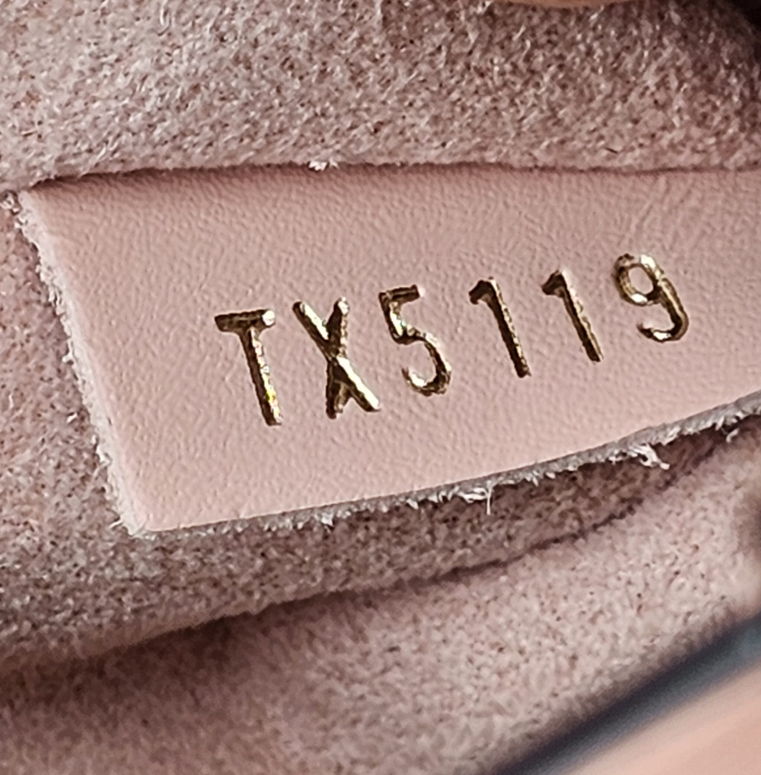 Date code TX5119 stamped on the Rose Poudre leather tab inside the Louis Vuitton NeoNoe MM