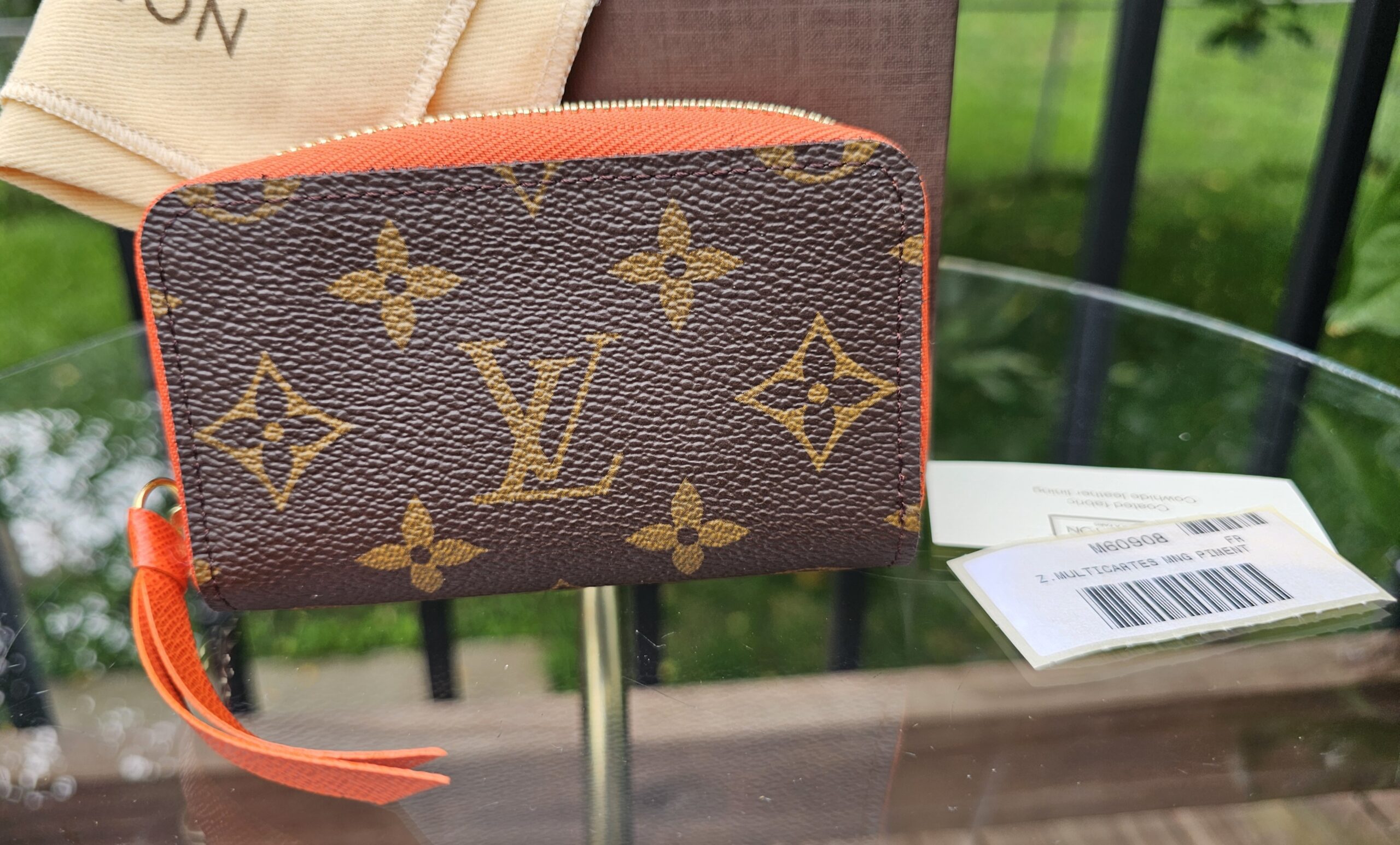 Louis Vuitton Monogram Zippy Multicartes shown with its dust bag and box
