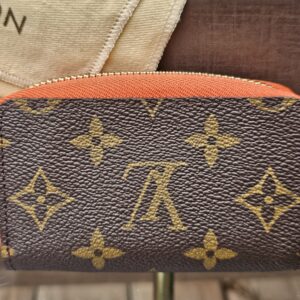 Front of the Louis Vuitton Zippy Multicartes showing the crisp Monogram canvas