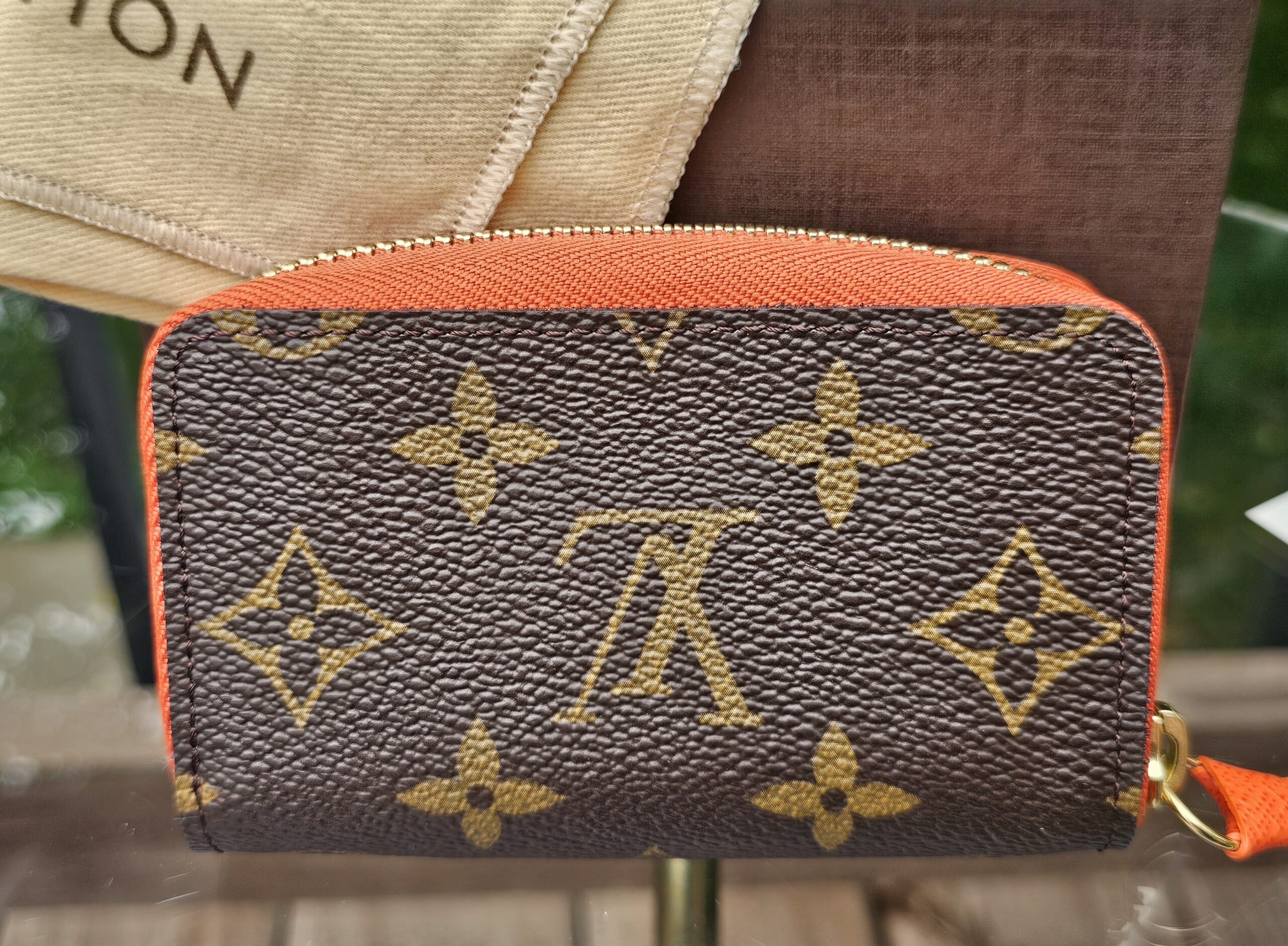 Front of the Louis Vuitton Zippy Multicartes showing the crisp Monogram canvas