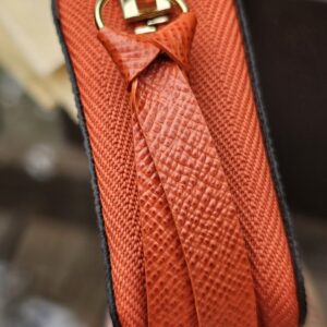 Piment orange leather zip pull and gold-tone hardware on the Louis Vuitton Zippy Multicartes