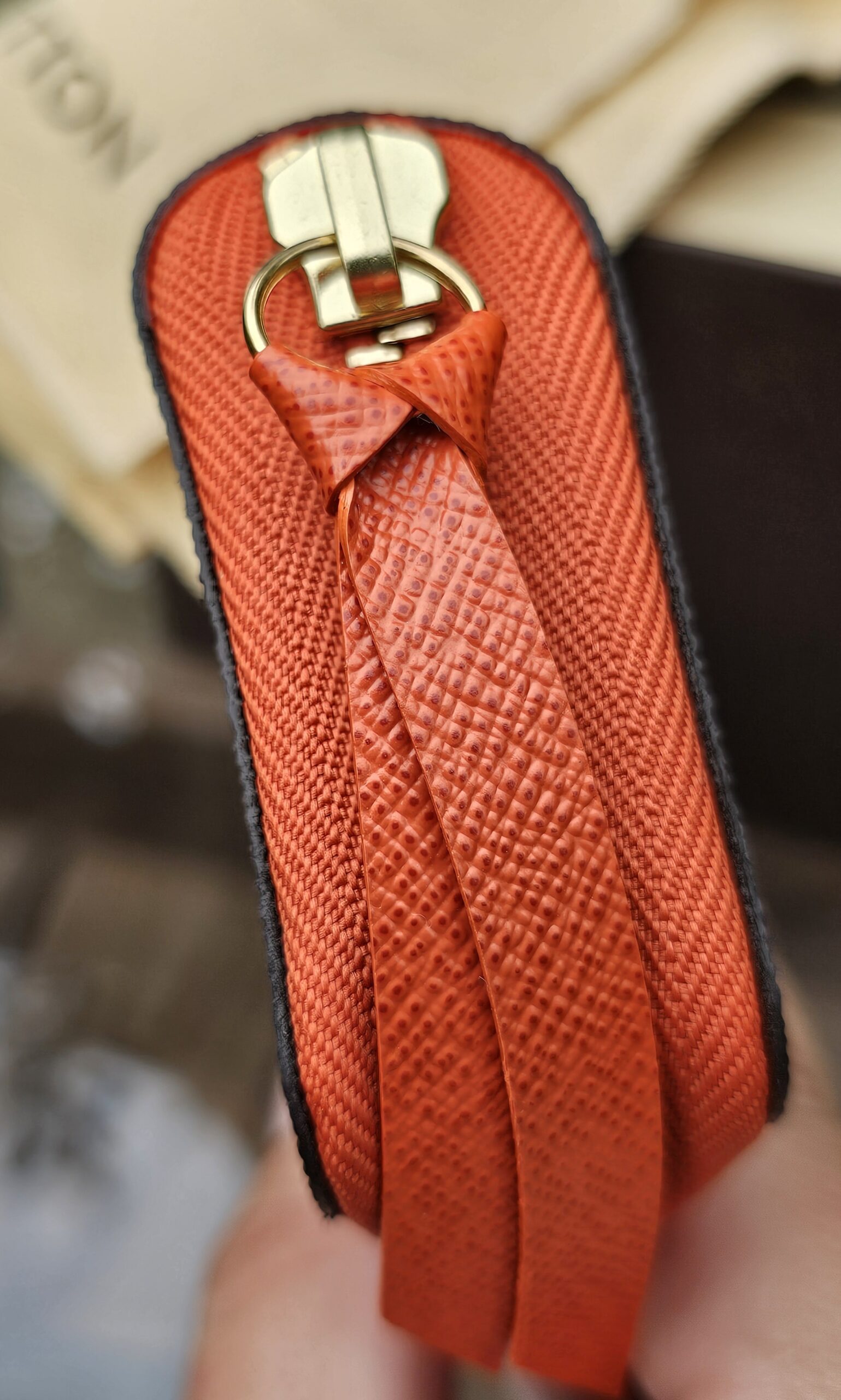Piment orange leather zip pull and gold-tone hardware on the Louis Vuitton Zippy Multicartes
