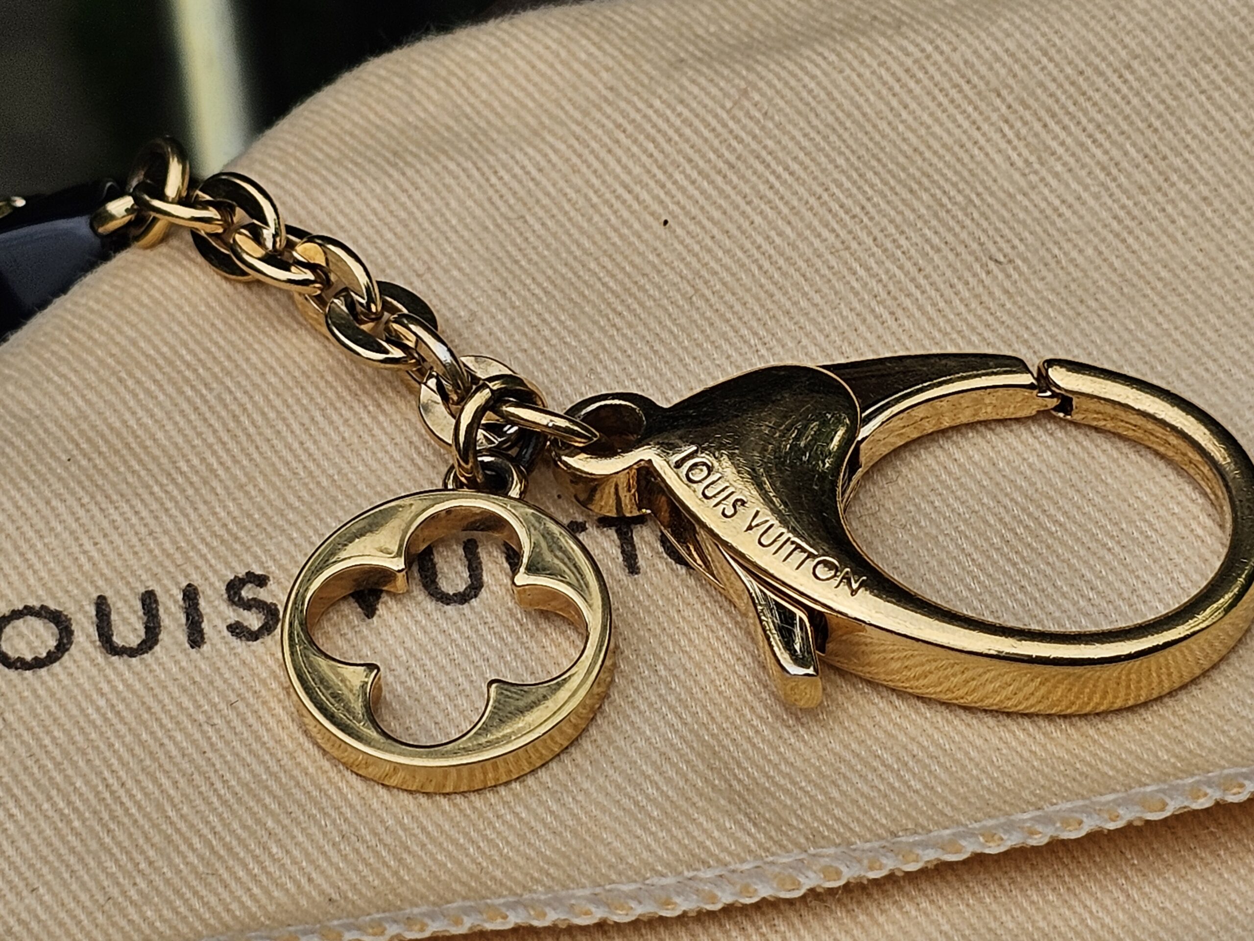 Louis Vuitton engraved on the clasp of the Fleur d Etoile key holder and bag charm