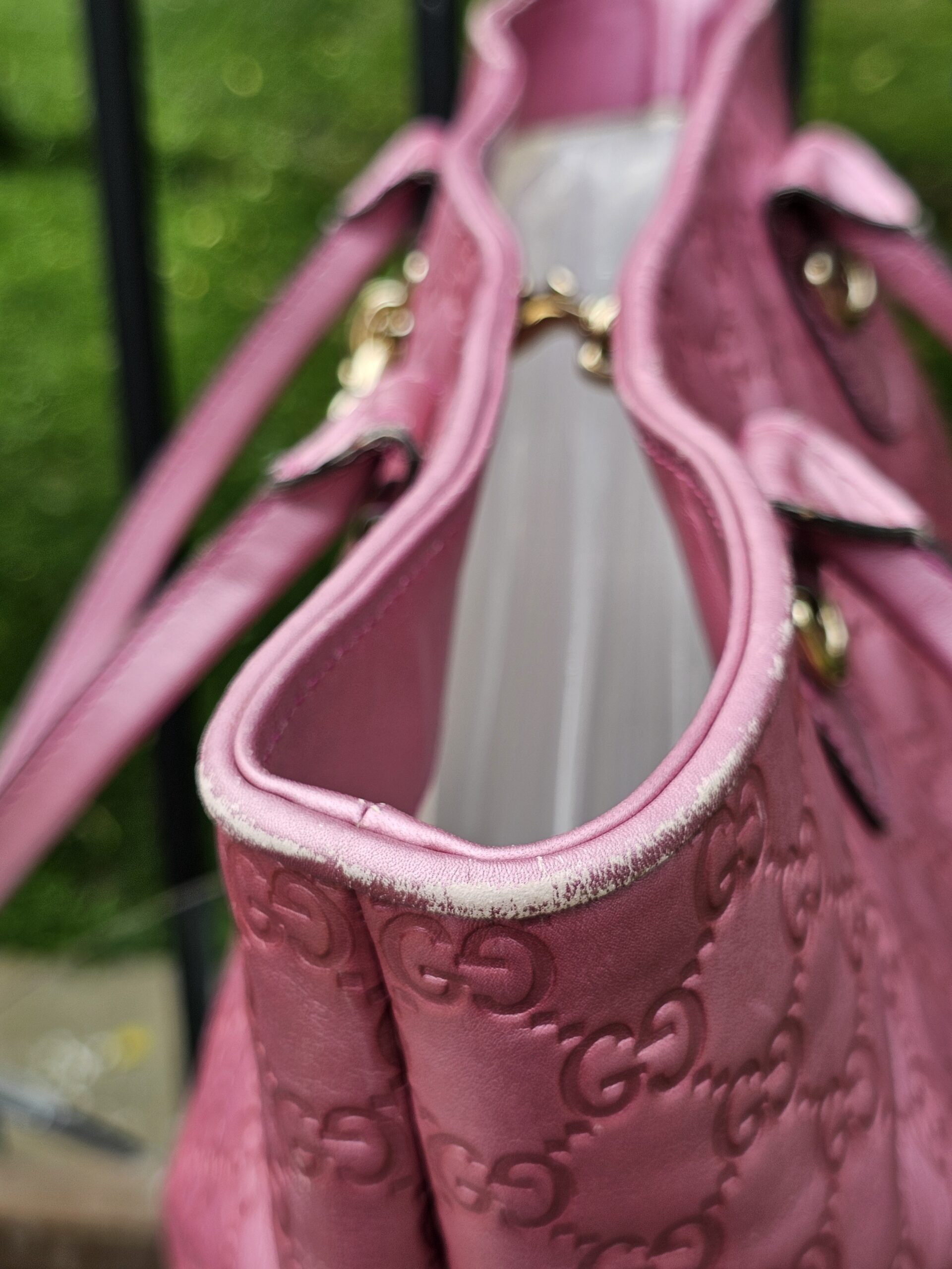 Open top of the Gucci Heart Bit tote showing the light canvas interior