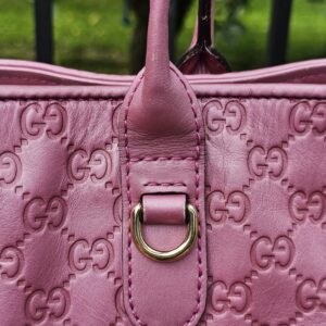 Gold-tone D-ring hardware on the Gucci Guccissima Large Heart Bit tote