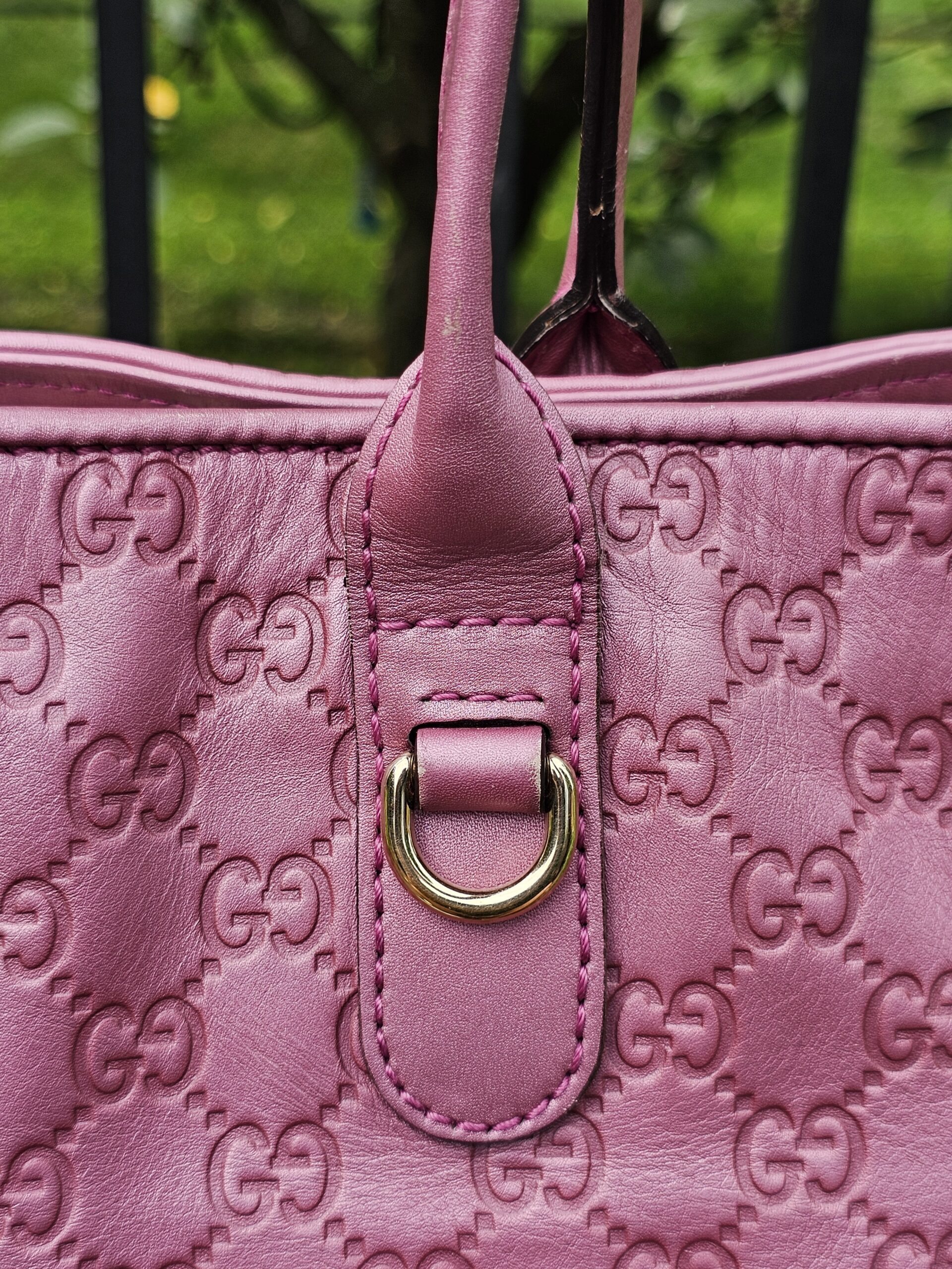 Gold-tone D-ring hardware on the Gucci Guccissima Large Heart Bit tote