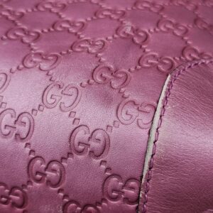 Pink Guccissima embossed leather and stitching on the Gucci Heart Bit tote