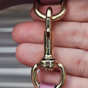 Gold-tone horsebit clasp hardware on the Gucci Heart Bit tote