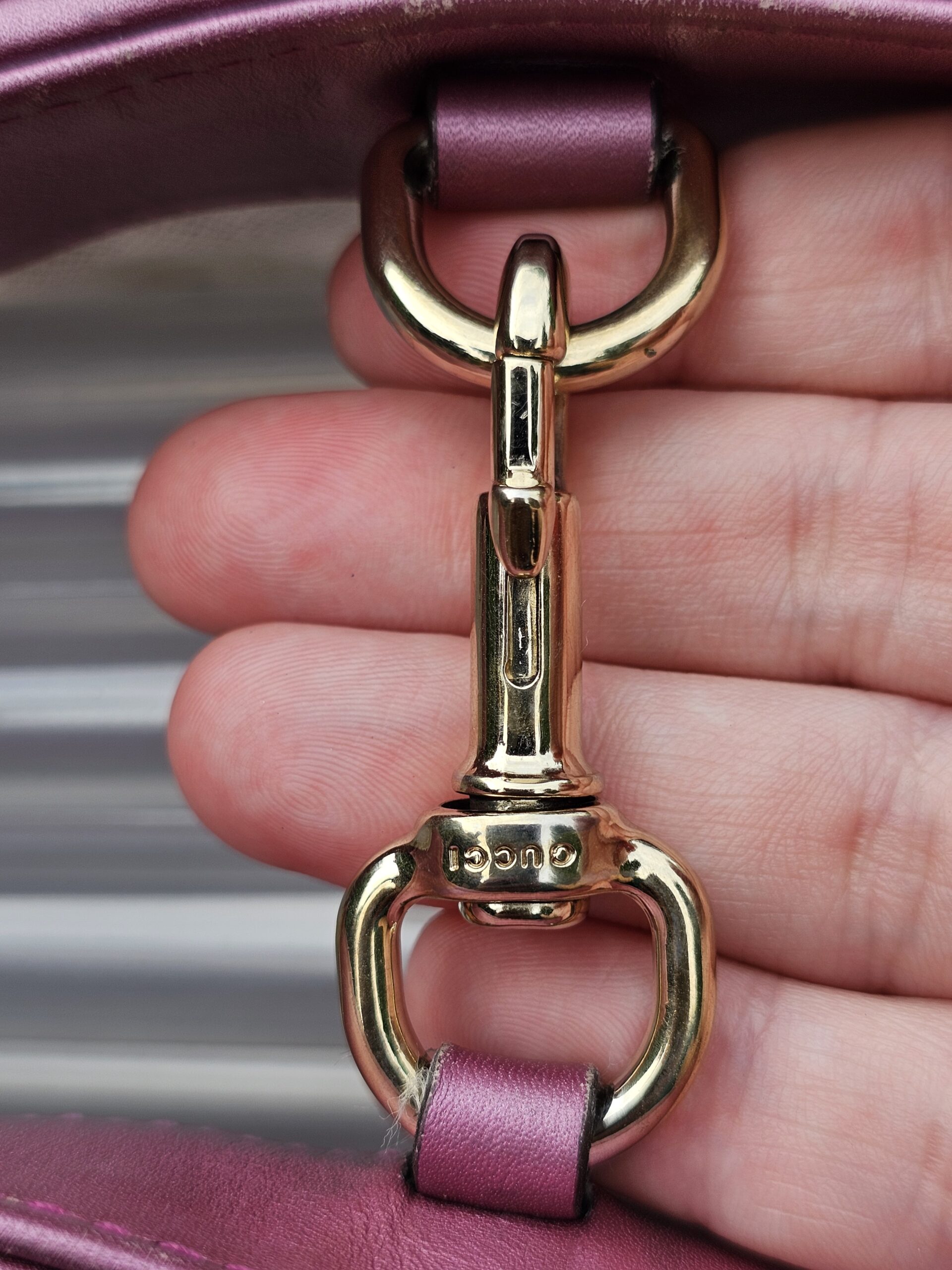 Gold-tone horsebit clasp hardware on the Gucci Heart Bit tote