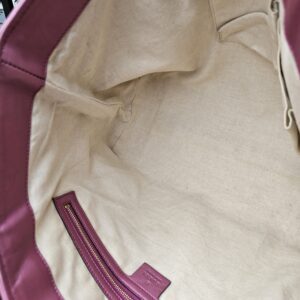 Interior slip pockets inside the Gucci Heart Bit tote