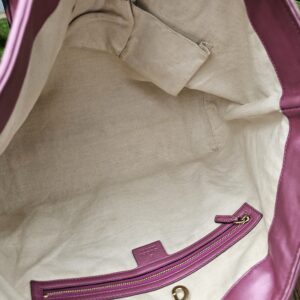 Interior zip pocket of the Gucci Guccissima Large Heart Bit tote