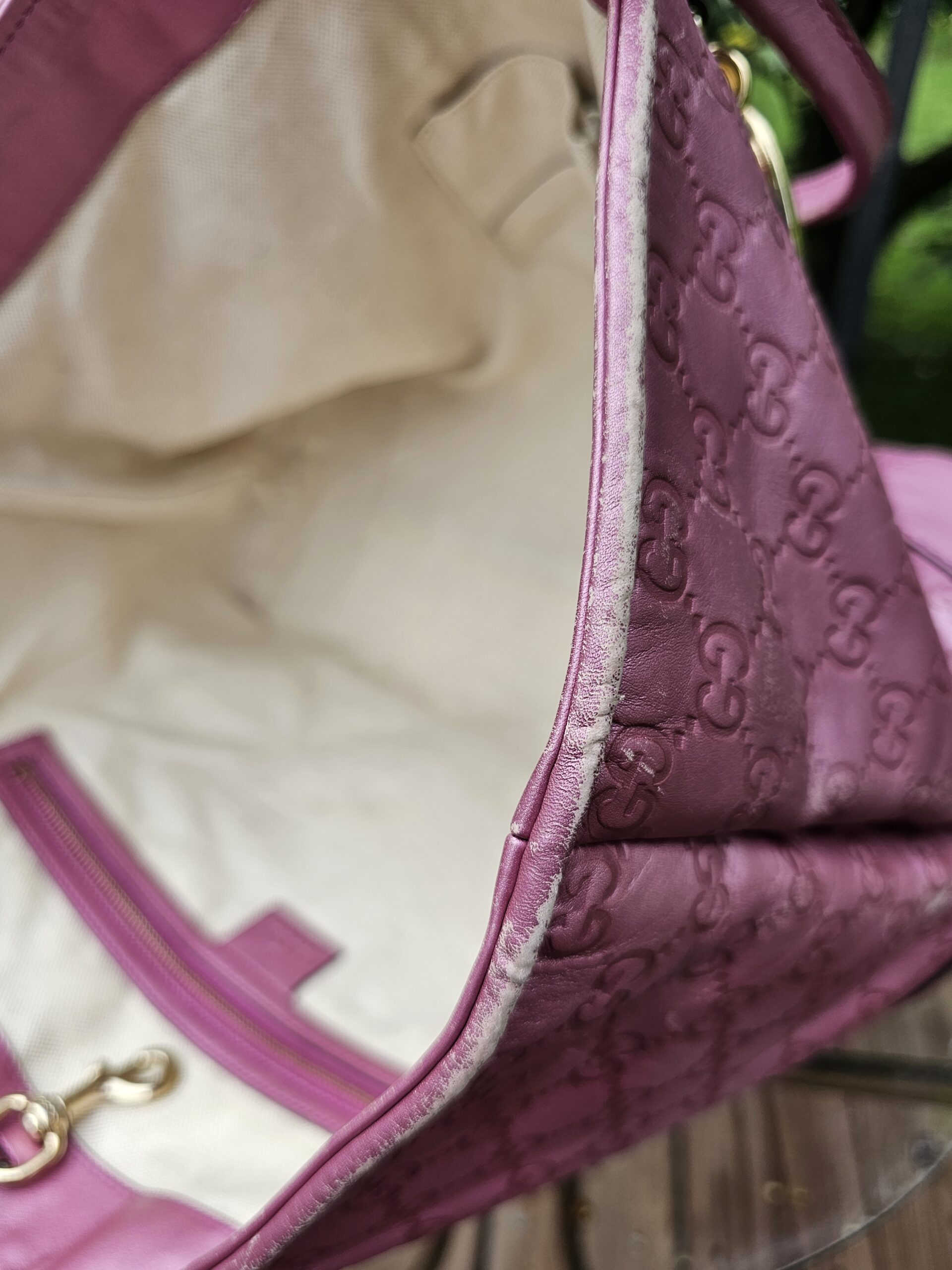 Canvas interior of the Gucci Heart Bit tote shown for light marks from use