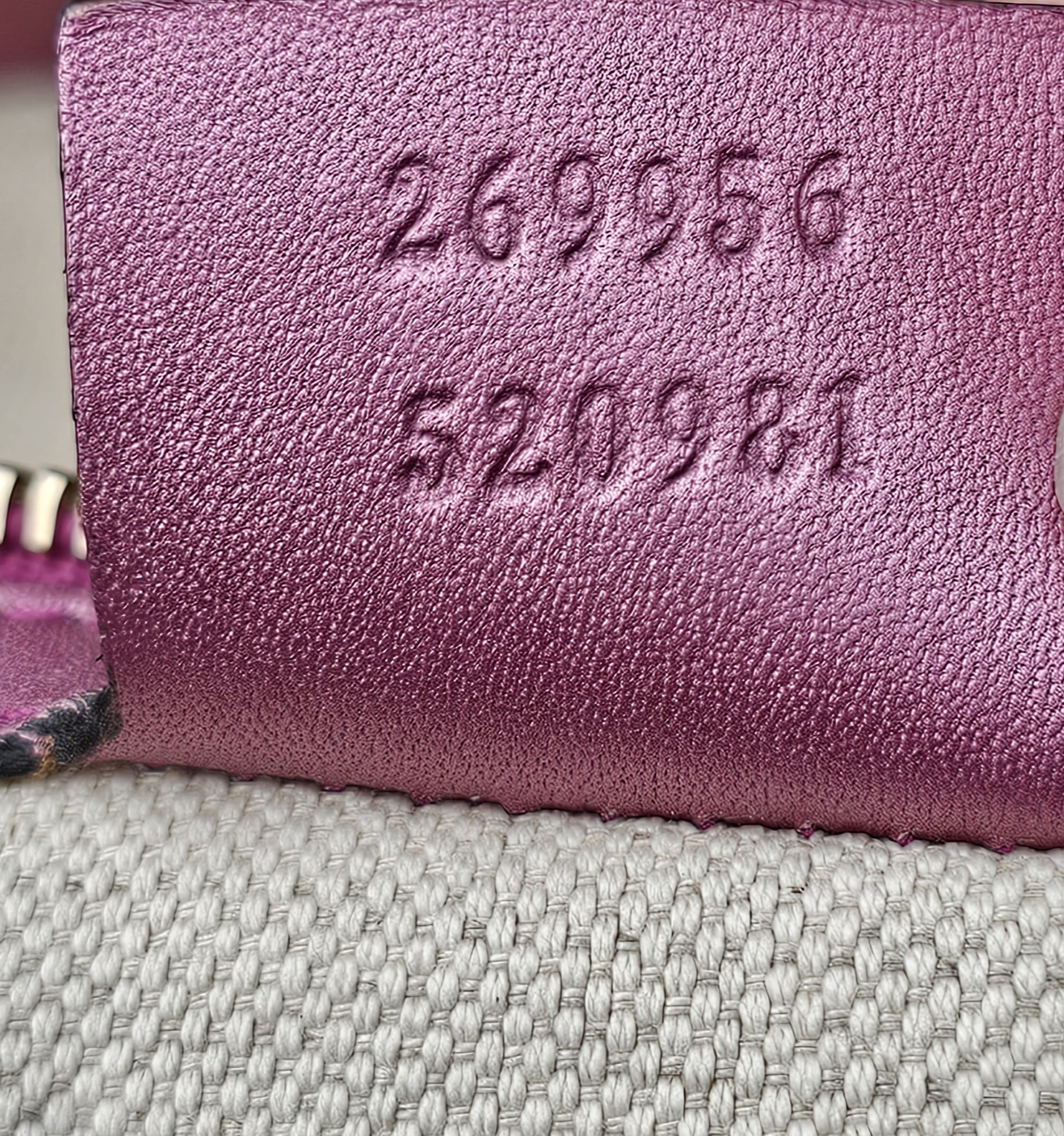 Style numbers 269956 and 520981 embossed on the tag inside the Gucci Heart Bit tote
