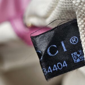 Gucci care label sewn inside the pink Guccissima Heart Bit tote