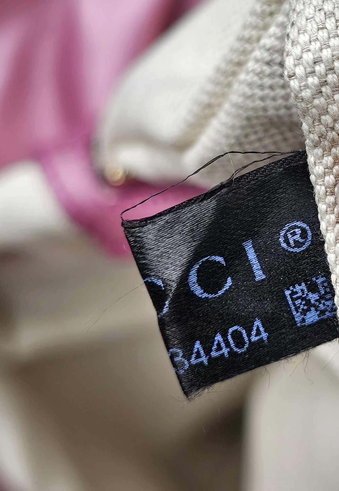Gucci care label sewn inside the pink Guccissima Heart Bit tote