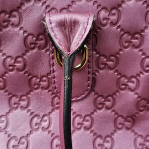 Zip and pink leather trim inside the Gucci Guccissima Heart Bit tote