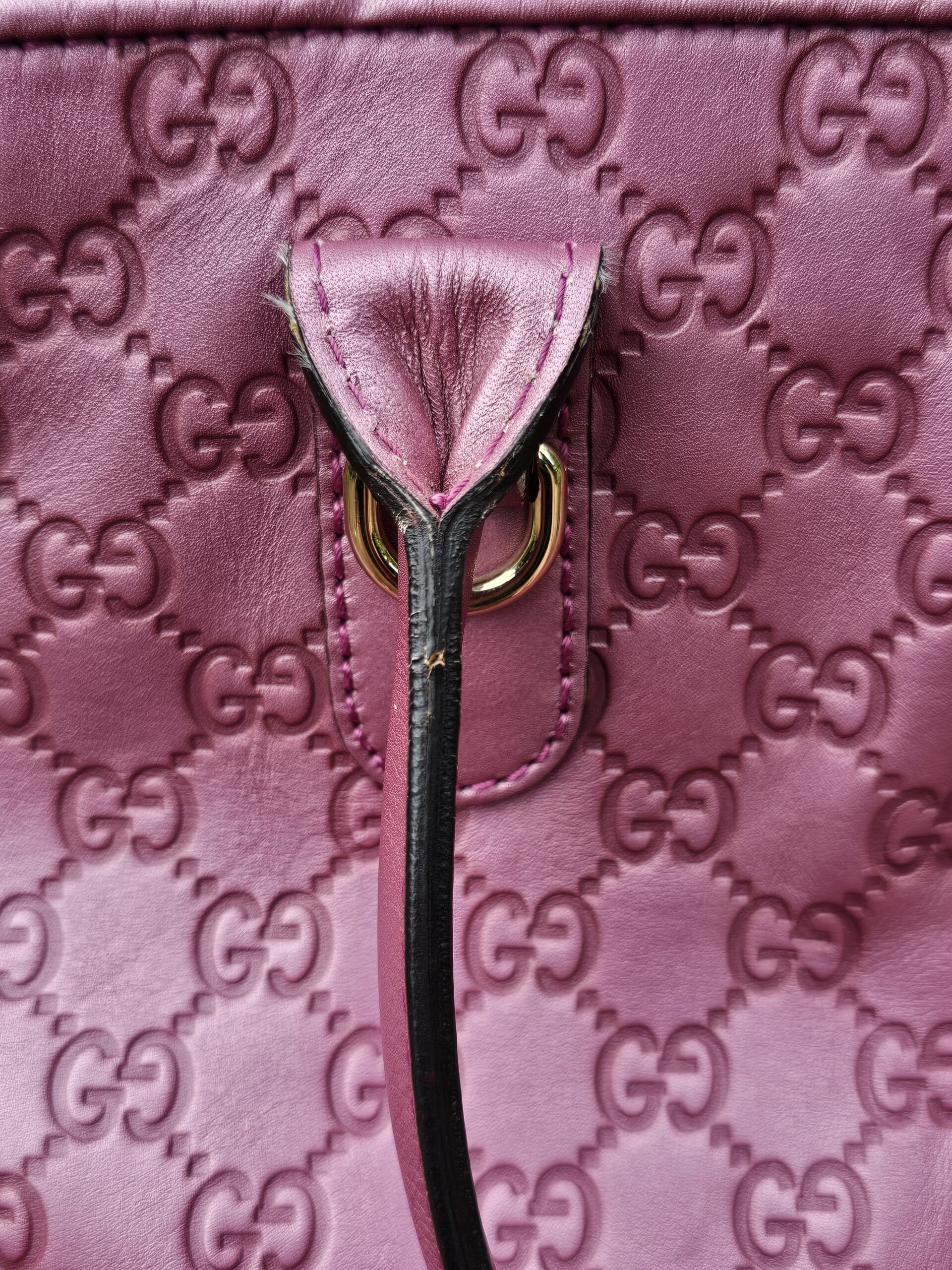 Zip and pink leather trim inside the Gucci Guccissima Heart Bit tote