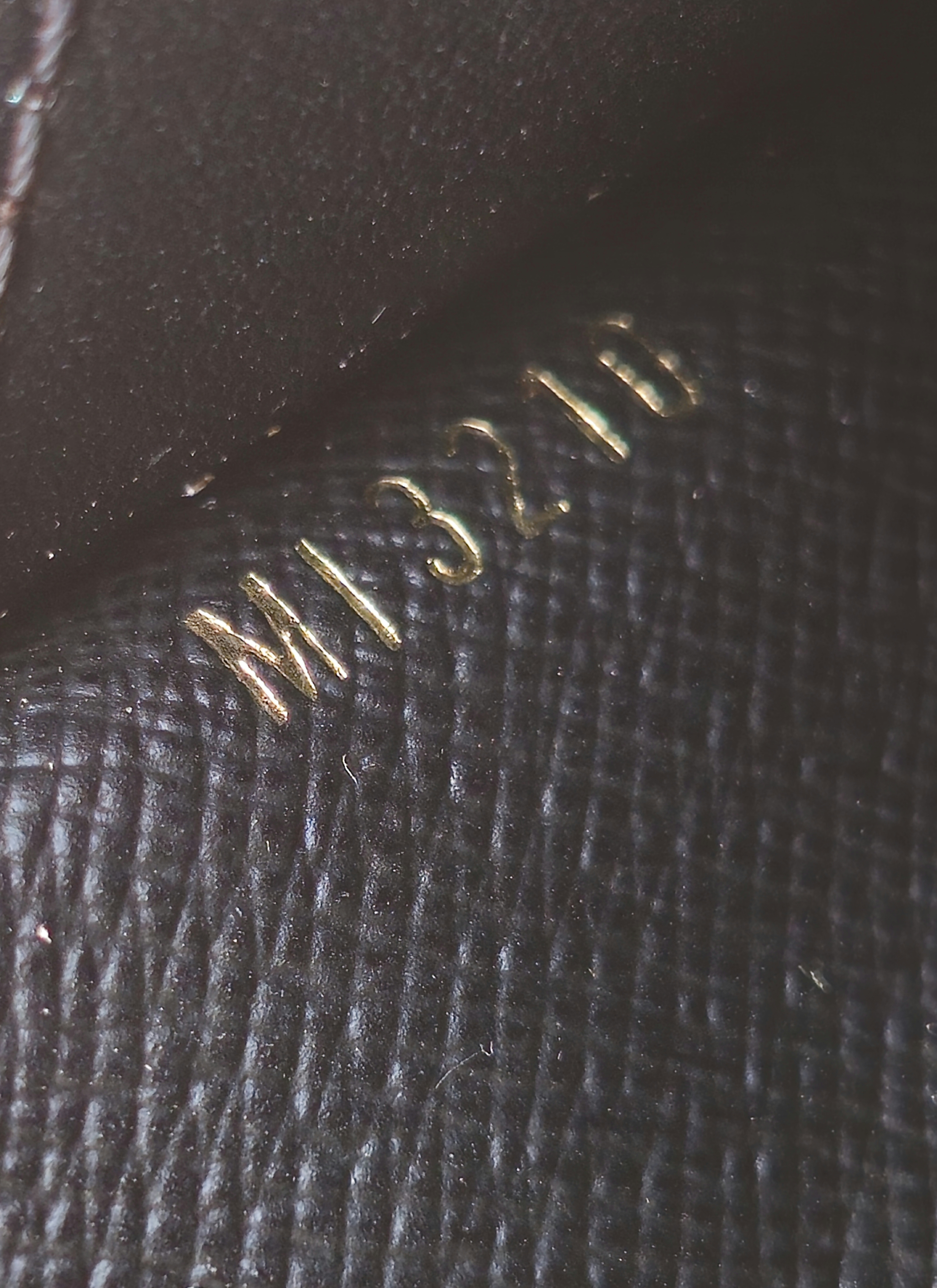 Date code MI3210 stamped inside the Louis Vuitton Monogram Recto Verso card holder