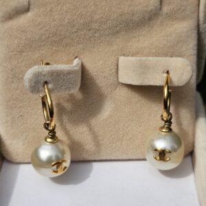 Chanel faux pearl drop earrings in the box showing the gold-tone CC logos set into the pearls