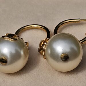 Chanel faux pearl drop earrings showing the gold-tone hoop design and pearl drops