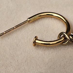Pierced post and gold-tone hoop of the Chanel faux pearl drop earring