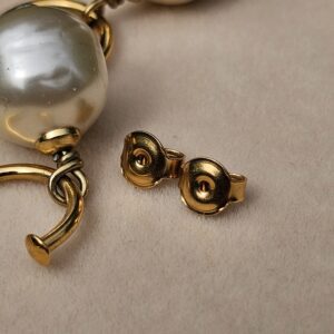 Gold-tone butterfly backs for the Chanel faux pearl pierced drop earrings