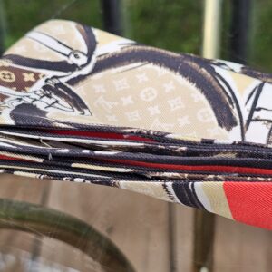Rolled silk edge of the Louis Vuitton Monogram Trunks bandeau