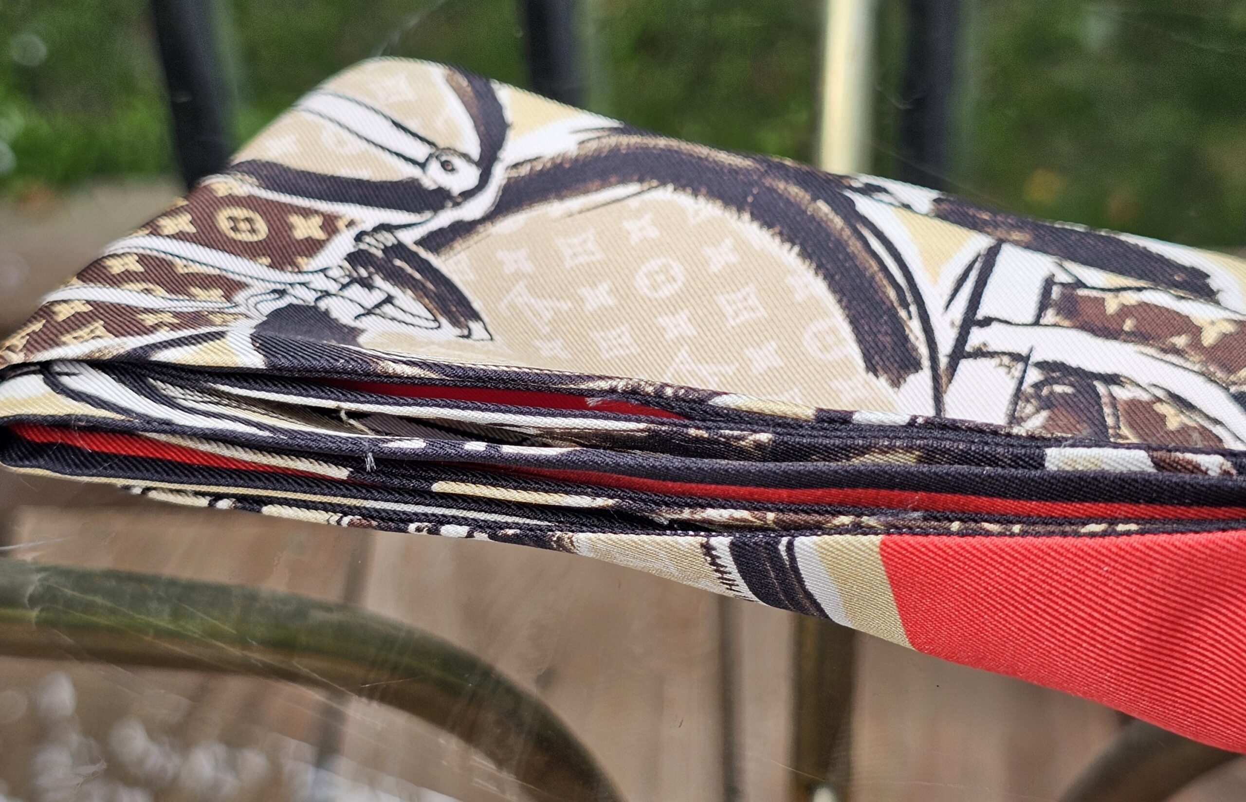 Rolled silk edge of the Louis Vuitton Monogram Trunks bandeau