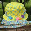 Louis Vuitton Virgil Abloh reversible bucket hat in yellow Monogram Playground cotton with a braided cord and LV beads