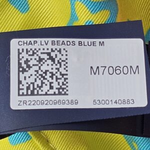 Retail tag for the Louis Vuitton Virgil Abloh bucket hat reading CHAP LV BEADS BLUE M with style number M7060M
