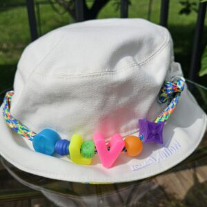 Reverse white side of the Louis Vuitton Virgil Abloh bucket hat with the beaded braided cord