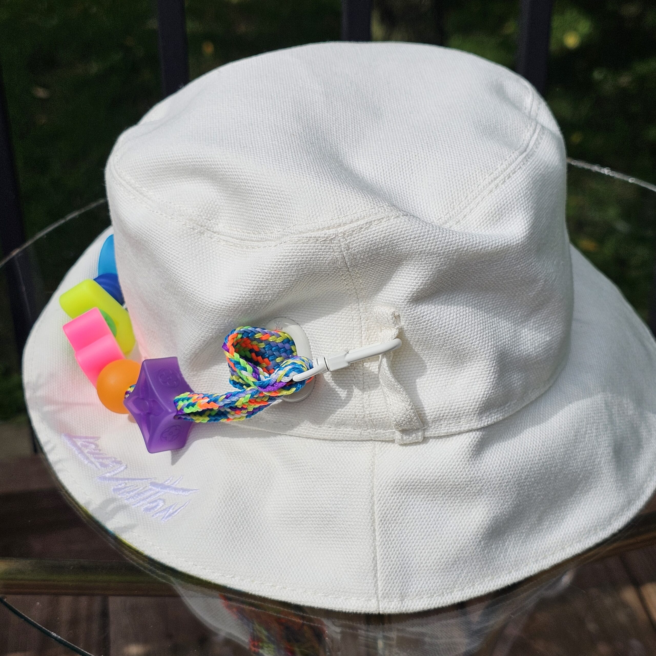 White reverse side of the Louis Vuitton Virgil Abloh bucket hat with the Louis Vuitton signature print