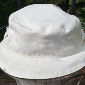 Side profile of the white side of the Louis Vuitton Virgil Abloh reversible bucket hat