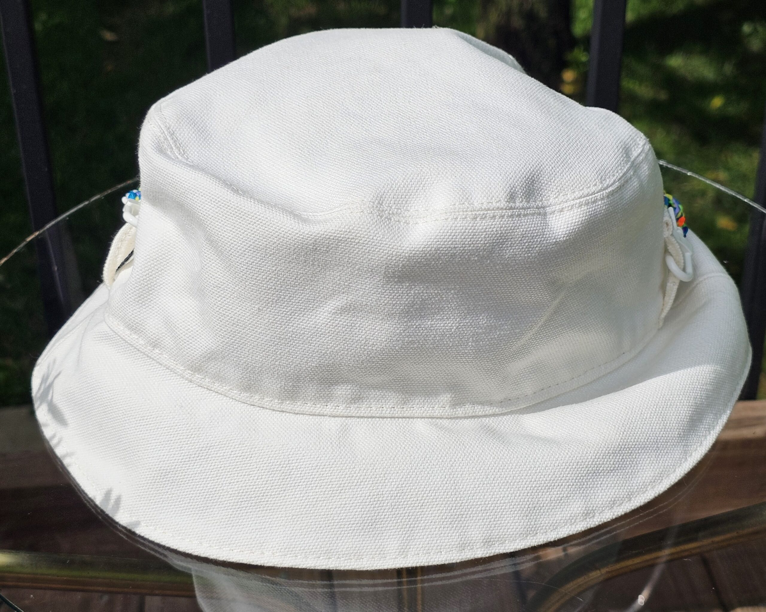 Side profile of the white side of the Louis Vuitton Virgil Abloh reversible bucket hat