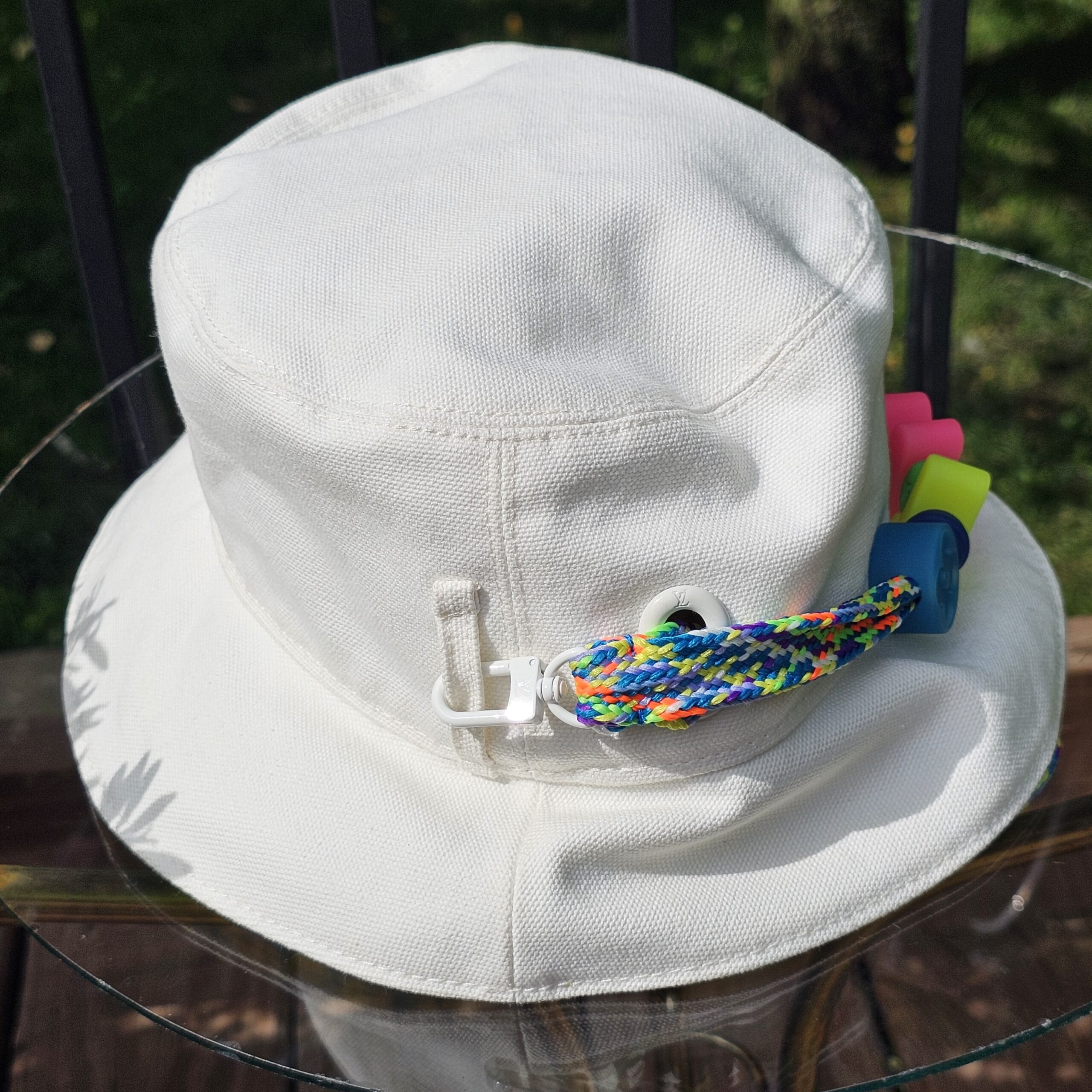 Braided cord attached to the white side of the Louis Vuitton Virgil Abloh bucket hat