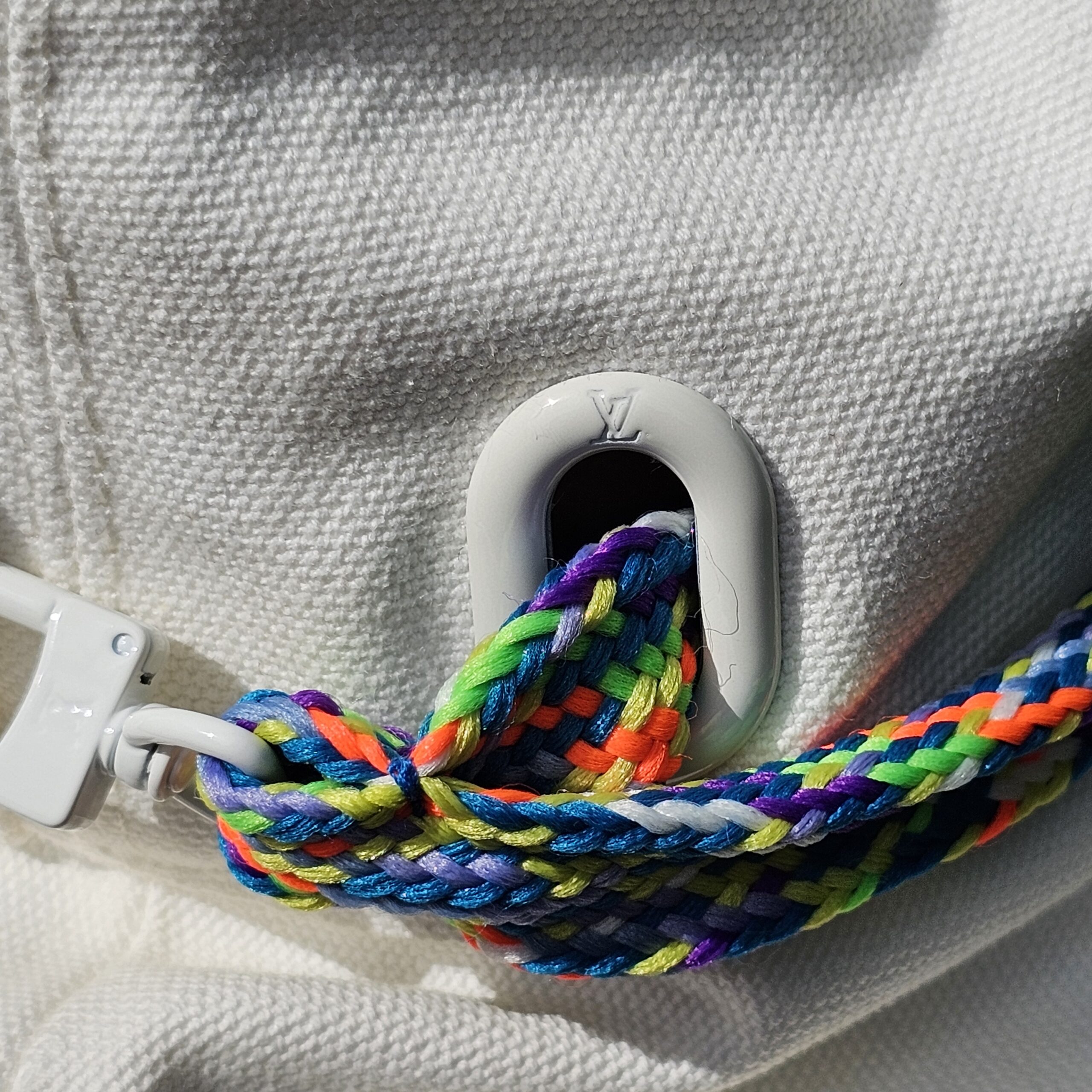 Close-up of the cord loop and white toggle on the Louis Vuitton Virgil Abloh bucket hat