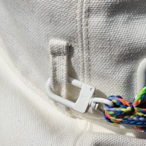 White plastic toggle and braided cord on the Louis Vuitton Virgil Abloh bucket hat