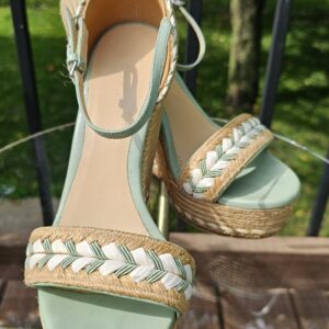 Gucci espadrille wedge sandals in mint green leather with braided cream trim on a natural jute wedge