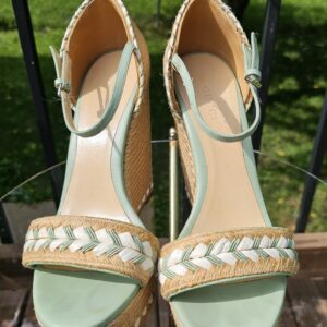 Top view of both Gucci mint green espadrille wedge sandals showing the braided toe straps and ankle straps