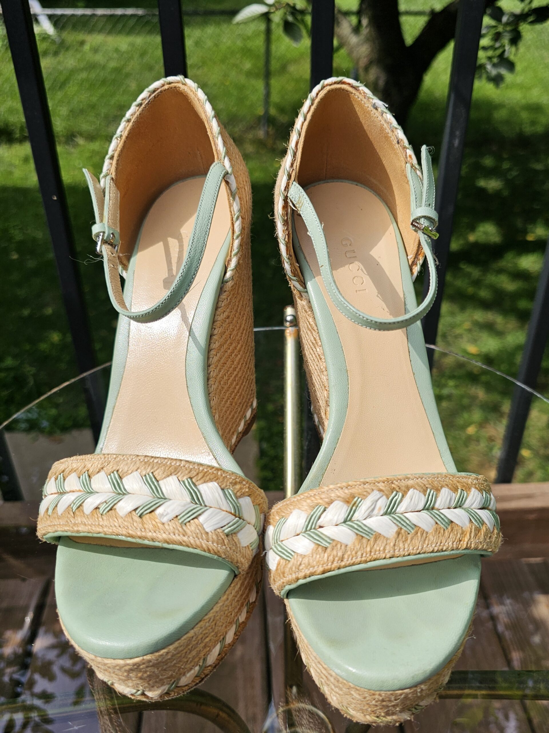 Top view of both Gucci mint green espadrille wedge sandals showing the braided toe straps and ankle straps