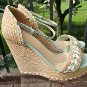 Side profile of the Gucci mint green espadrille wedge sandal showing the jute wedge and front platform
