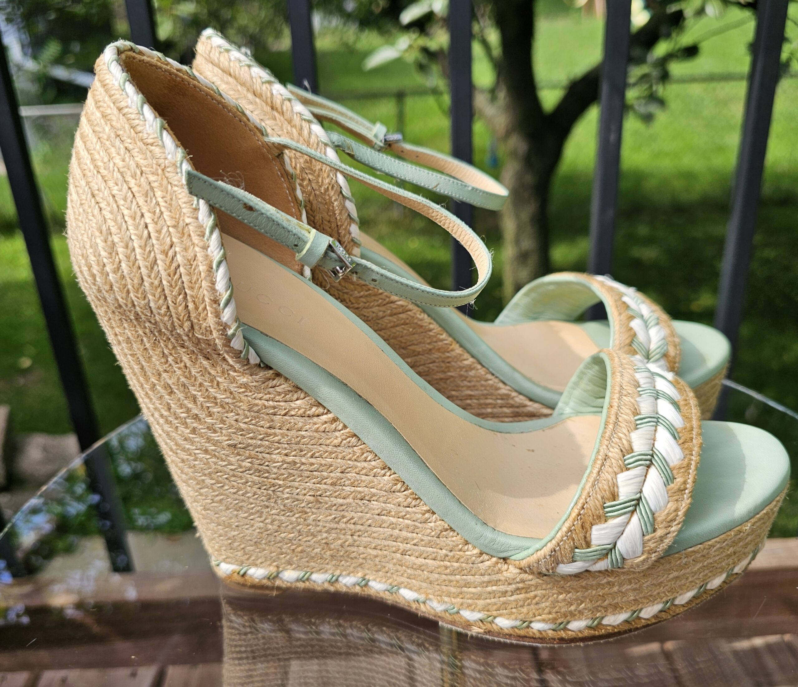Side profile of the Gucci mint green espadrille wedge sandal showing the jute wedge and front platform