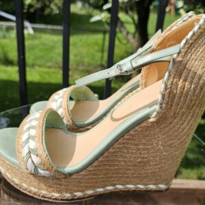 Natural woven jute wedge and platform of the Gucci mint green espadrille sandals