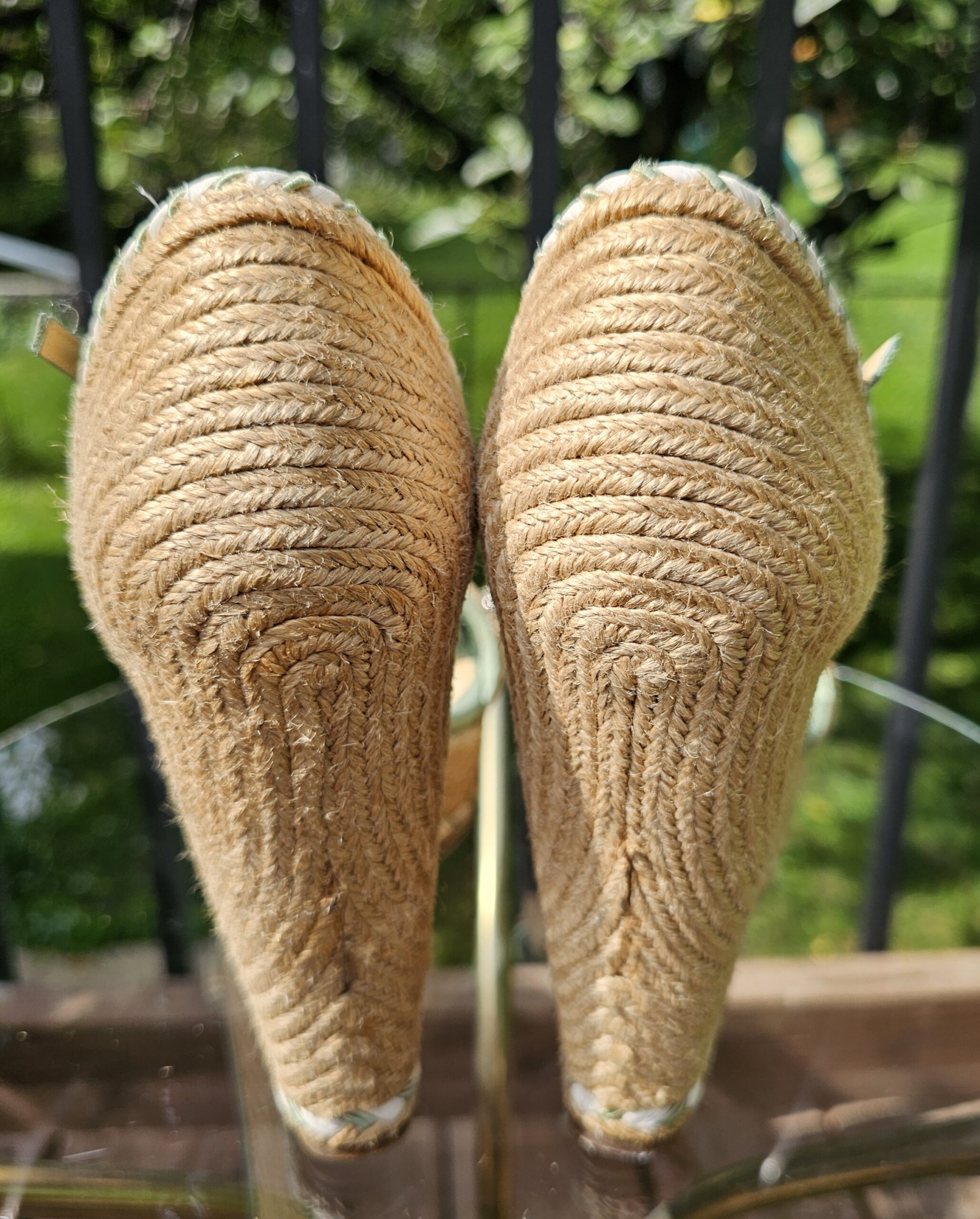 Back view of the Gucci espadrille wedge sandals showing the jute wrapped wedges