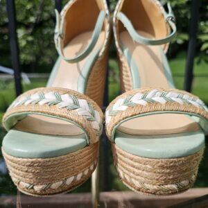 Cream and mint braided trim across the toe straps of the Gucci espadrille wedge sandals